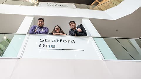 Students looking over the balcony